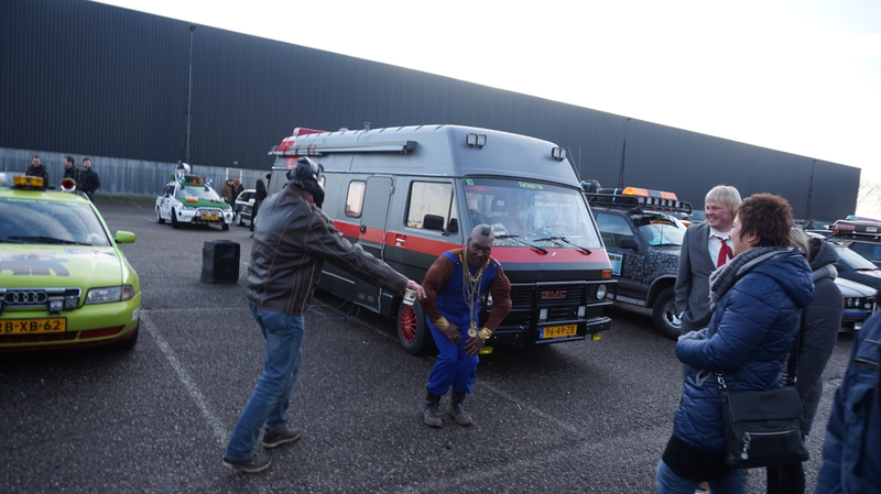 VW/GMC A-team campervan, joined by some guys in questionable A-team outfits doing a weird dance.
